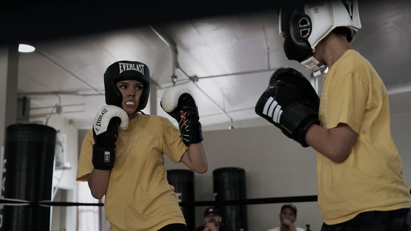 Two youth boxers sparring